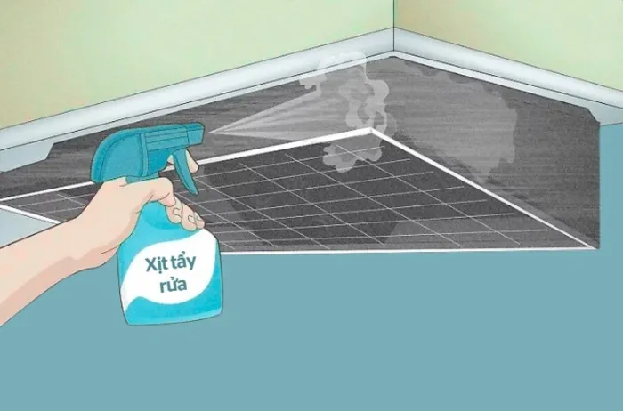 Thấm khăn mềm vào dung dịch tẩy rửa hoặc xịt trực tiếp lên bề mặt khung máy hút mùi